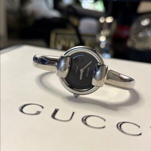 Gucci Black and Silver bangel bracelet woman’s watch